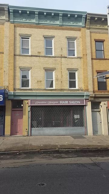 Jersey City apartment for rent - the front of a hair salon on a city street