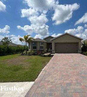 Cape Coral house for rent - a brick driveway in front of a house