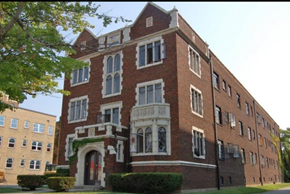 Indianapolis apartment for rent - A red brick building with a white arched entrance.