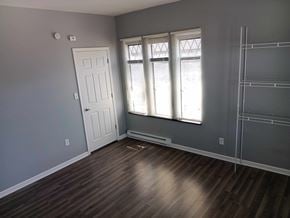 Indianapolis apartment for rent - A room with a white door and a window with blinds.