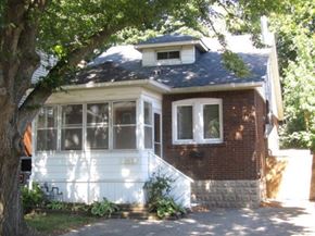 Hamilton apartment for rent - a red brick house with a tree in front of it