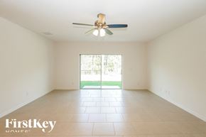 Kissimmee house for rent - a empty living room with a ceiling fan