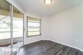 Rotonda West house for rent - a living room with a sliding glass door and a window