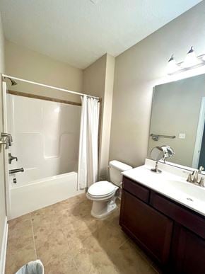 Jacksonville house for rent - A bathroom with a toilet, sink, and bathtub.