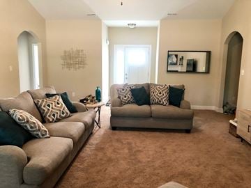 Jacksonville house for rent - A living room with two couches and a rug.