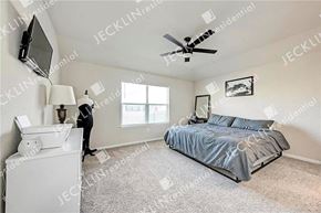 Georgetown house for rent - a bedroom with a bed and a ceiling fan