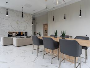 Oshawa apartment for rent - a dining room with a wooden table and grey chairs