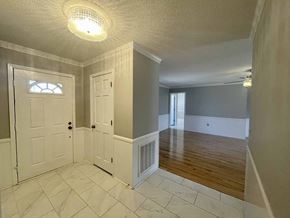 Greer house for rent - A room with a white door and a window.