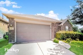 Little Elm house for rent - a garage door in front of a brick house
