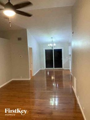 Colorado Springs house for rent - a empty living room with a ceiling fan