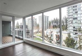 Vancouver apartment for rent - A room with a view of a cityscape through large windows.