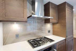 Vancouver apartment for rent - A modern kitchen with a white countertop and a stainless steel range hood.