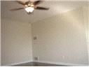 Covina apartment for rent - A room with a ceiling fan and light.