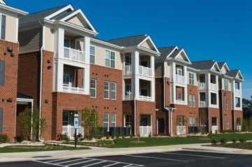 Fall River apartment for rent - a row of brick and white apartment buildings on a street
