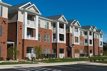 Fall River apartment for rent - a row of brick and white apartment buildings on a street