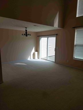 Mason apartment for rent - A room with a light on the ceiling and a window with blinds.