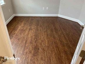 Lehigh Acres house for rent - a room with a wooden floor and a white wall