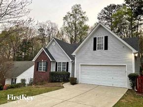 Sugar Hill house for rent - a white house with a garage and a driveway