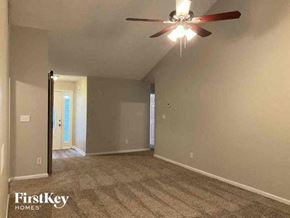 Sugar Hill house for rent - an empty living room with a ceiling fan