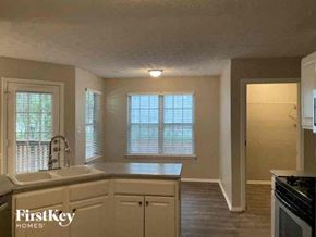 Sugar Hill house for rent - a kitchen with a sink and a stove and a window