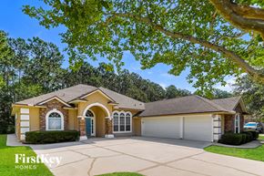 Jacksonville house for rent - a house with a driveway and a garage door