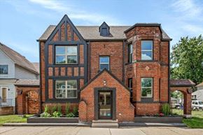 Detroit apartment for rent - a red brick house with a black roof