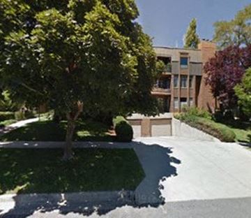 Slc apartment for rent - A tree is in front of a building.