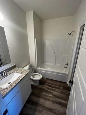Youngsville apartment for rent - a bathroom with a toilet and a sink and a bath tub