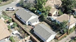Lakewood house for rent - an aerial view of a neighborhood with houses and roofs and cars