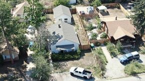 Lakewood house for rent - a birdseye view of a neighborhood with a house and cars parked in front
