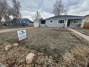 Wheat Ridge house for rent - a yard with a for sale sign in front of a house