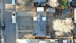 Wheat Ridge house for rent - an aerial view of a parking lot with trees and cars