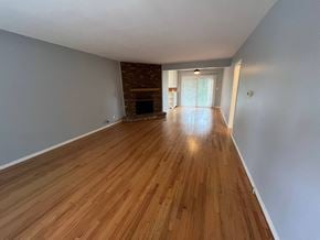 Fullerton apartment for rent - A room with wooden flooring and a fireplace.