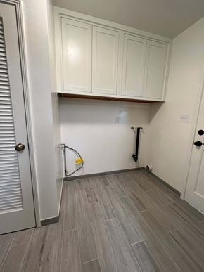 Fullerton apartment for rent - A room with a white door and a vacuum cleaner.
