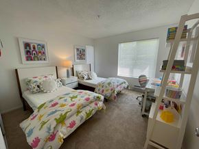 Vallejo apartment for rent - A bedroom with two beds and a bookshelf.