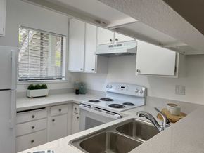 Vallejo apartment for rent - A kitchen with white cabinets and a stainless steel sink.