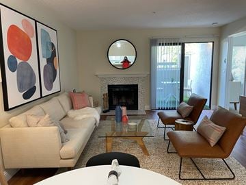 Vallejo apartment for rent - A living room with a fireplace and a painting on the wall.