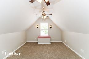 Gardendale house for rent - A room with a ceiling fan and a window with blinds.