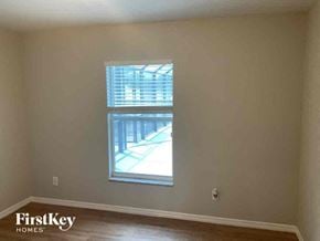 Cape Coral house for rent - a living room with a window and a hard wood floor