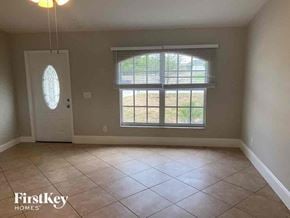 Cape Coral house for rent - an empty living room with a large window