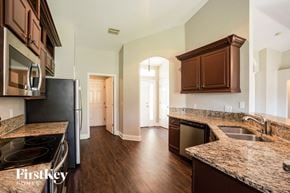 North Port house for rent - a renovated kitchen with granite counter tops and stainless steel appliances