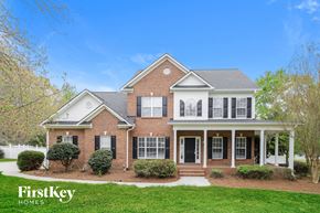 Advance house for rent - a brick house with white trim and black shutters
