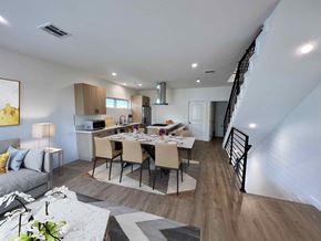 North Hollywood apartment for rent - a living room and kitchen with a table and chairs