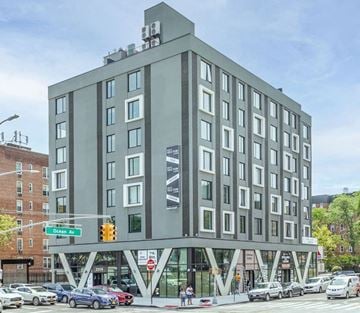 Brooklyn apartment for rent - a rendering of a grey building on a city street