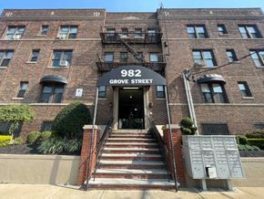 Irvington apartment for rent - The front of a brick building with the number 982 on it.