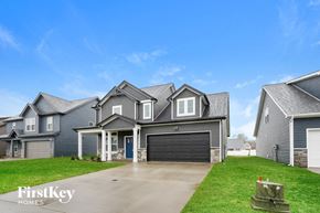 Clarksville house for rent - a large house with a driveway and a garage door