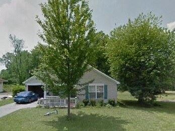 Warren house for rent - a house with a car parked in front of it