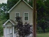 Warren house for rent - A house with a white door and a window.