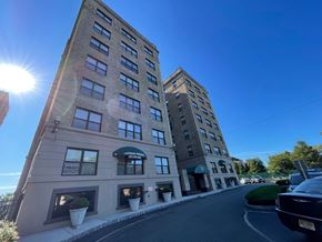 East Orange apartment for rent - A tall building with a sign that says "Liberty Bank" on it.