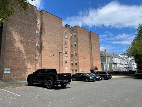 East Orange apartment for rent - A black pickup truck is parked in a parking lot.